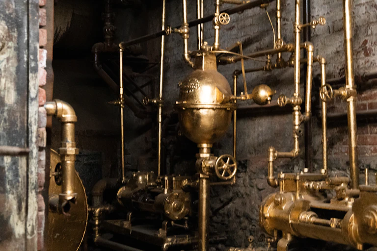 A complex network of golden pipes and machinery.